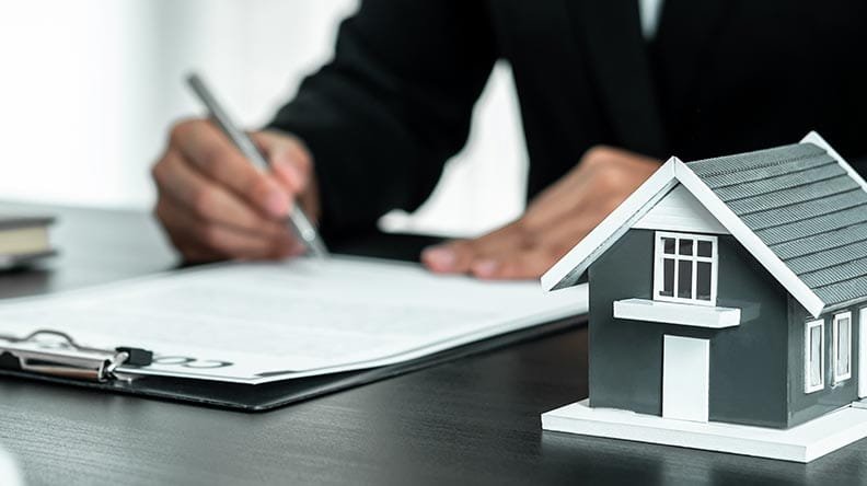 mortgage lender signing papers