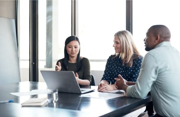 Colleagues in Meeting Room