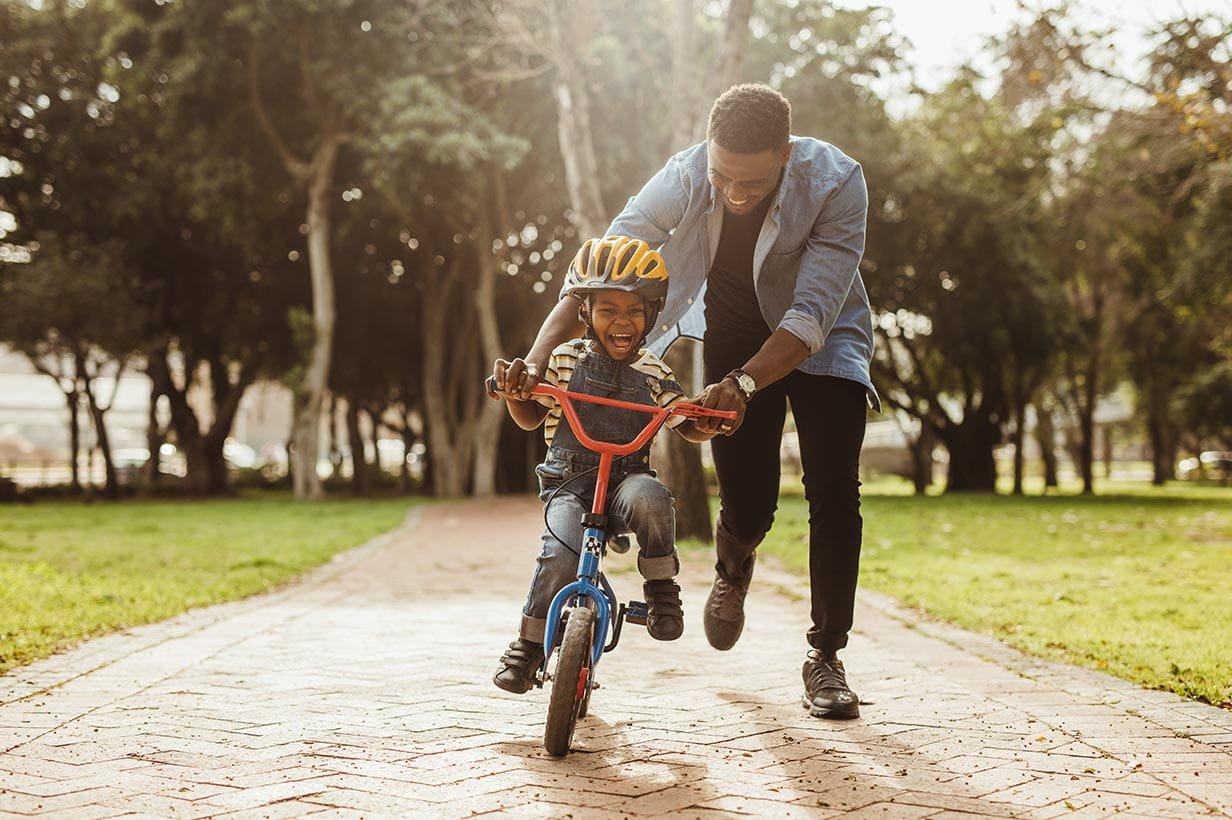 child learning to ride a bike